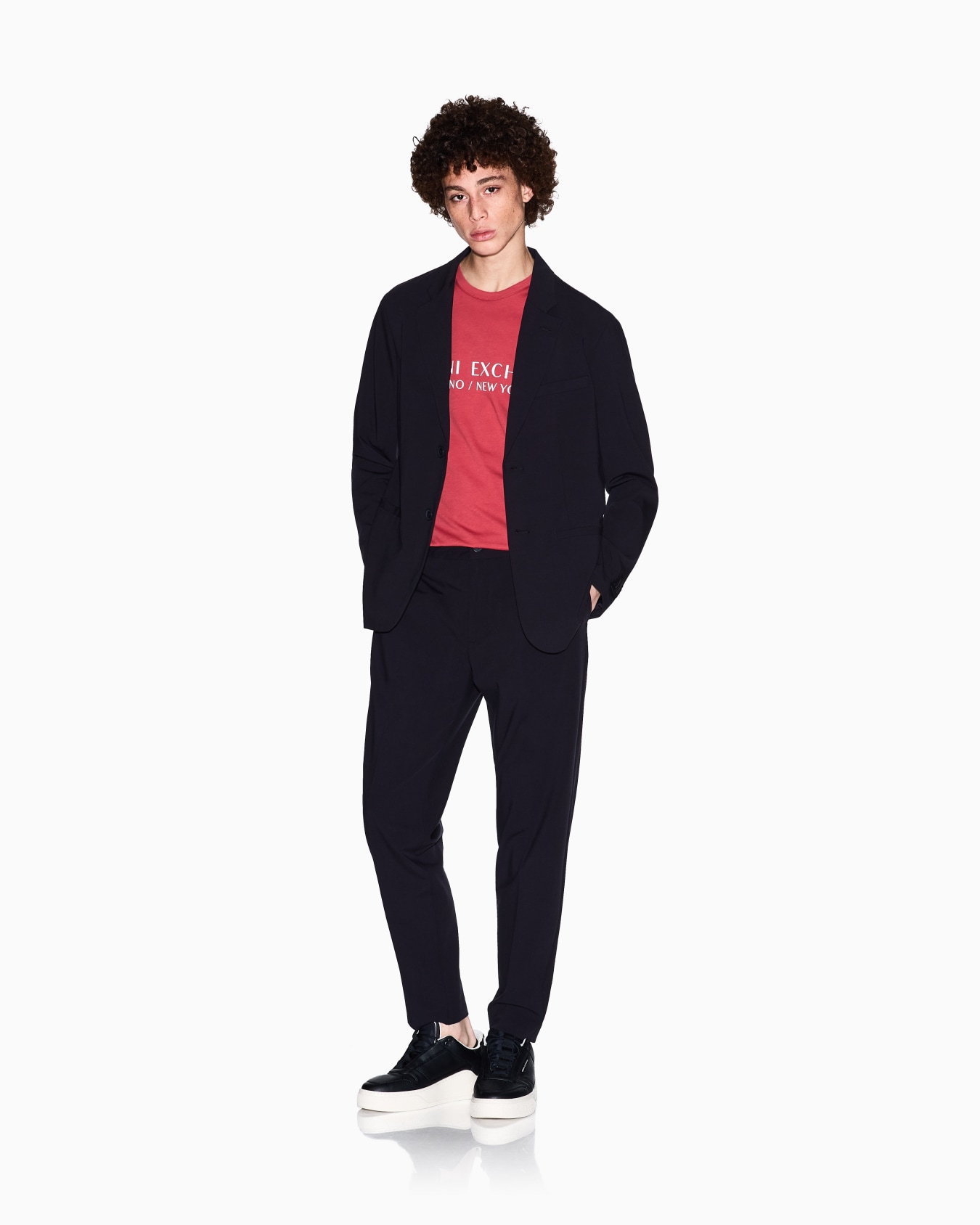Chino trousers in flowing fabric Slide 1
